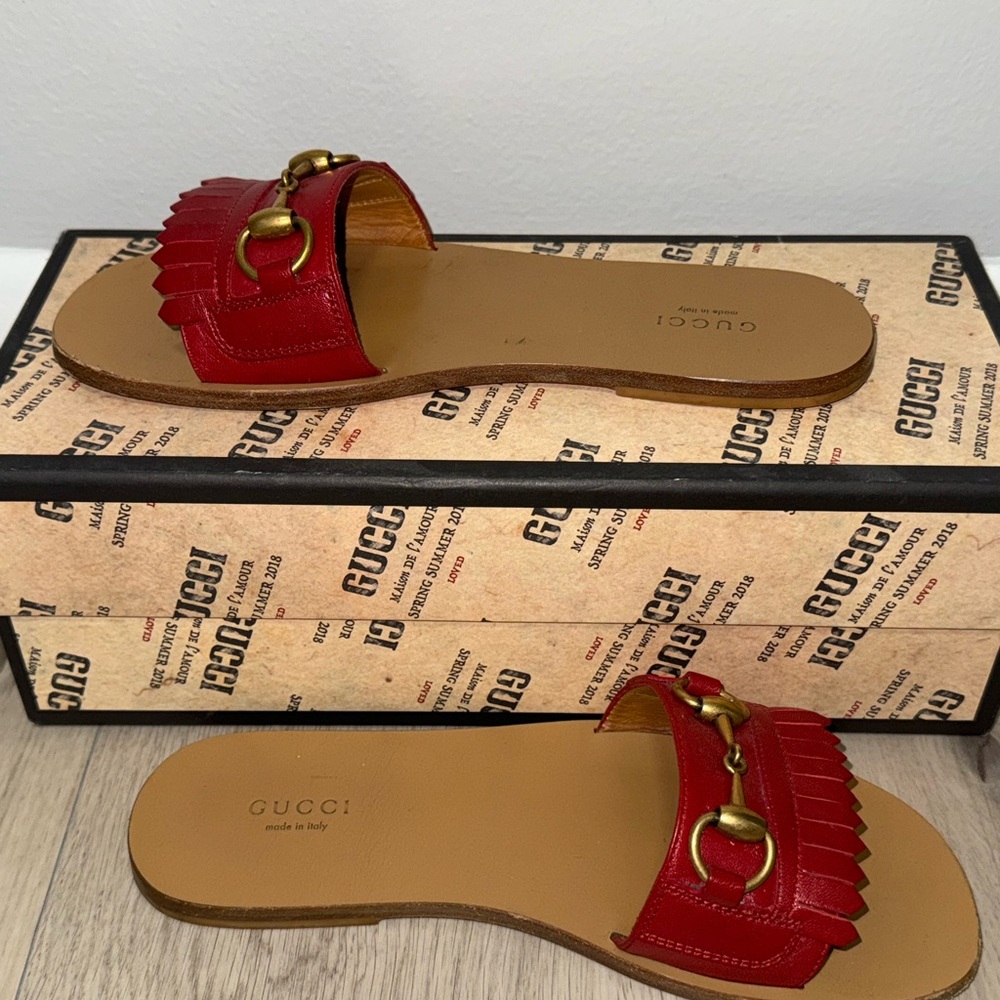 GUCCI 
Malaga Kid Fringe Horsebit Slide Sandals 37 1/2 Hibiscus Red